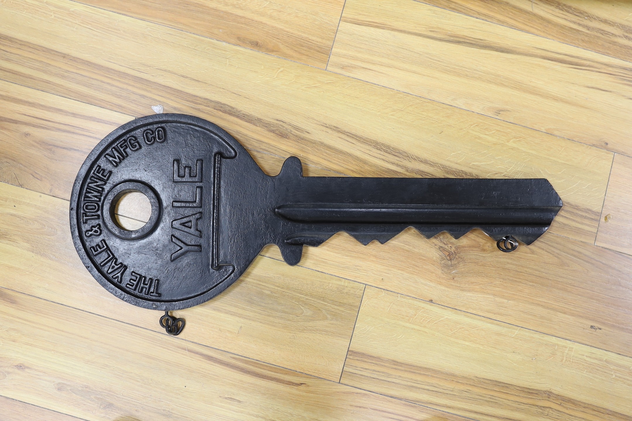 An oversized cast metal Yale advertising key. 78cm long